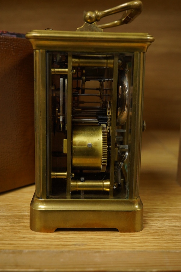 A French brass cased repeating carriage clock, striking on a bell, with key and case, 16cm high. Condition - fair, untested